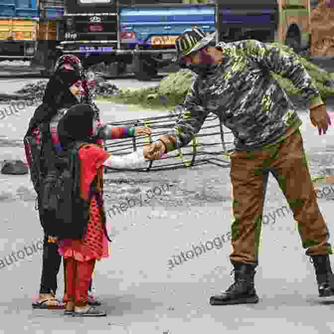 A Group Of People Holding Hands Amidst Ruins In Kashmir The Kashmir I Lost: A Broken Link