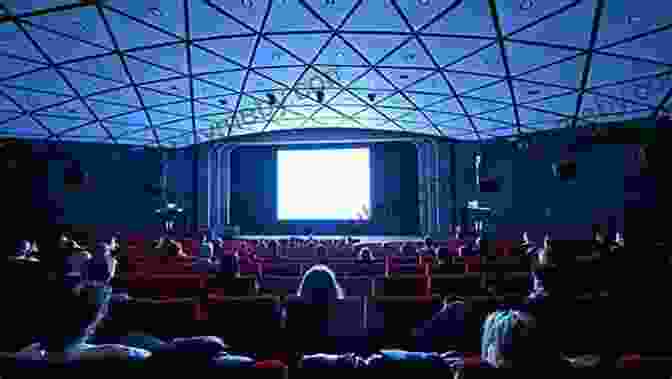 A Group Of People Watching A Movie On A Large Screen In A Cinema Powell And Pressburger: A Cinema Of Magic Spaces (Cinema And Society)