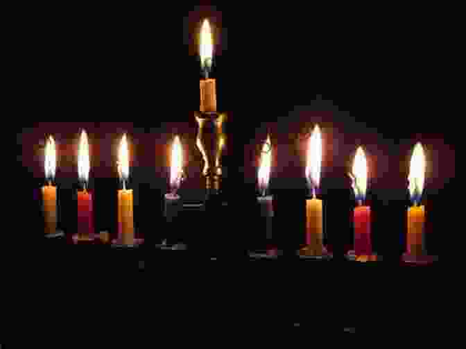 A Menorah With Lit Hanukkah Candles How I Saved Hanukkah Amy Goldman Koss