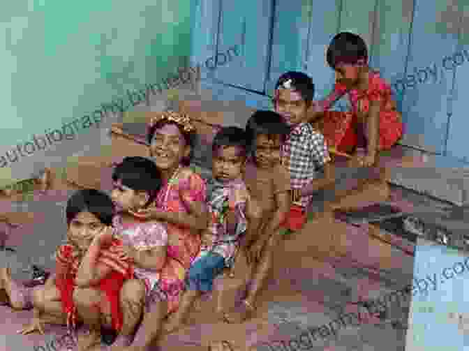 A Woman And Child Sitting On The Ground In A Slum. Winners Take All: The Elite Charade Of Changing The World