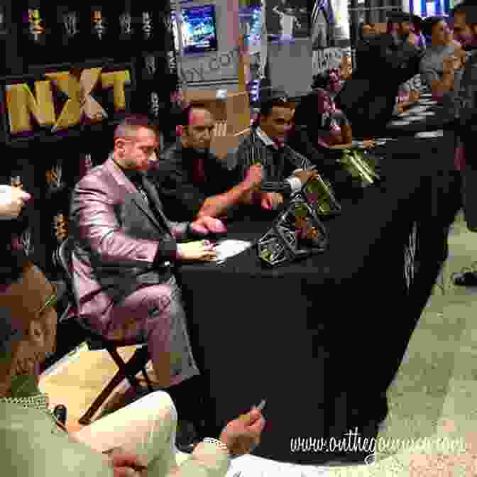 A Wrestler Signing Autographs For Fans The Philosophers Guide To Wrestling Or The Wrestlers Guide To Philosophy