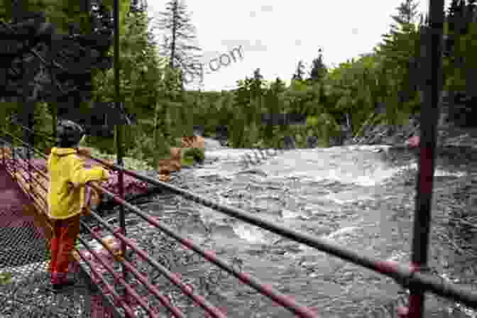 A Young Boy Standing On A Bridge, Looking Out Over A River Boy On The Bridge: The Story Of John Shalikashvili S American Success (American Warriors Series)