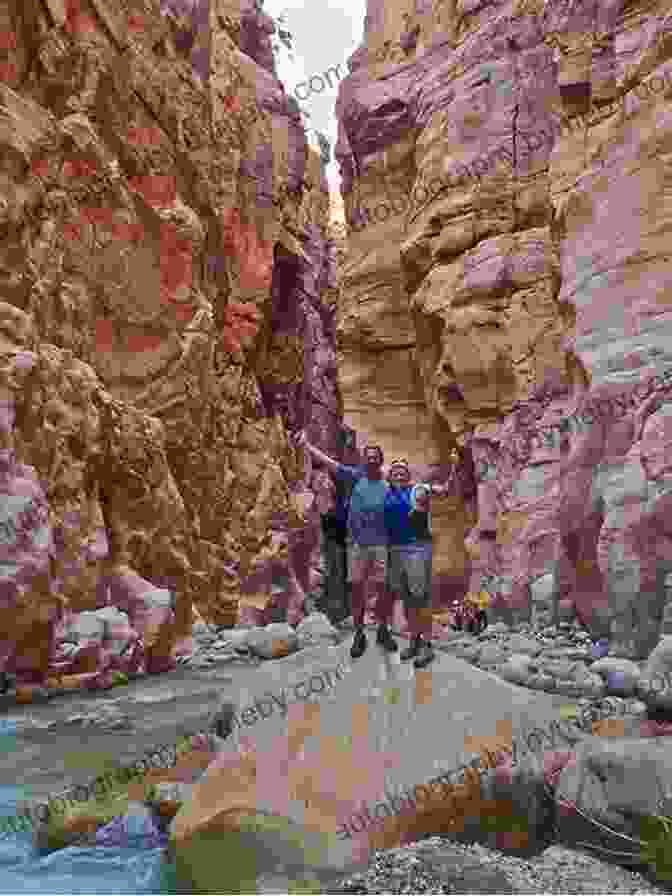 Hikers Trekking Through A Canyon In Jordan Hiking In Jordan: Trails In And Around Petra Wadi Rum And The Dead Sea Area With GPS E Trails Tracks And Waypoints Videos Planning Tools And Hiking Maps